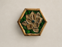 Front view of Mini Botanical Magnolia, a hand-carved walnut flower with preserved moss, a dark green glass cabochon and a pine hexagonal frame.