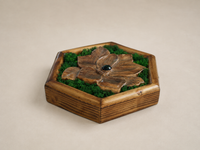 Three-quarter view of Mini Botanical Magnolia, showing its sculpted walnut petals, preserved moss and the depth of the pine frame.