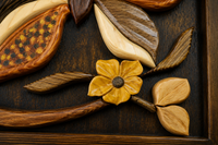 Close-up of carved flower, leaves and layered wooden elements showing natural grain and relief craftsmanship.